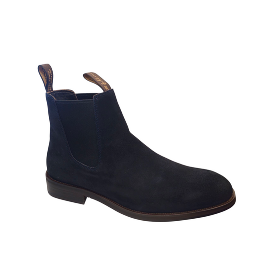 Navy blue suede Chelsea boot on a white background